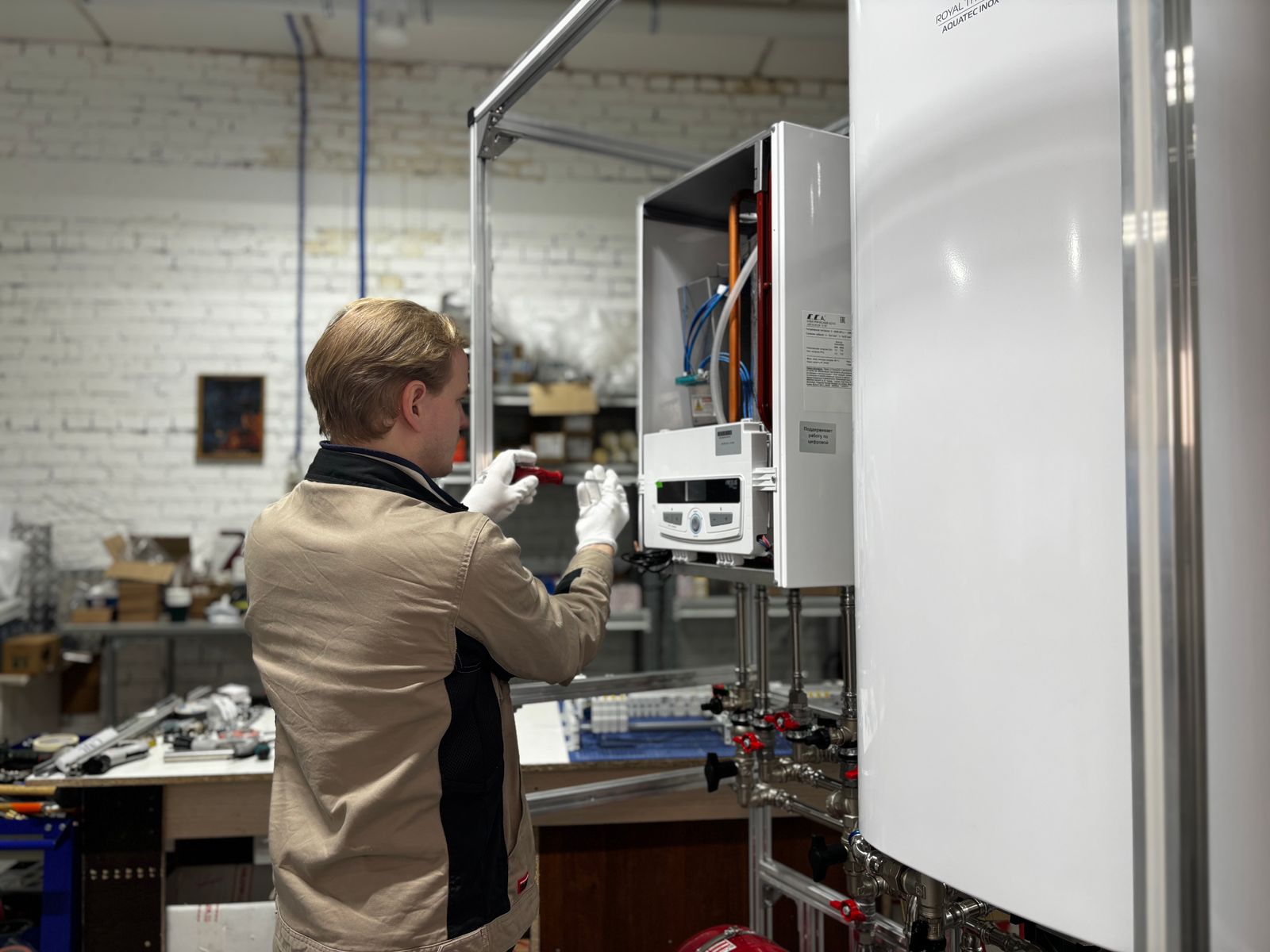 A technician servicing heating equipment