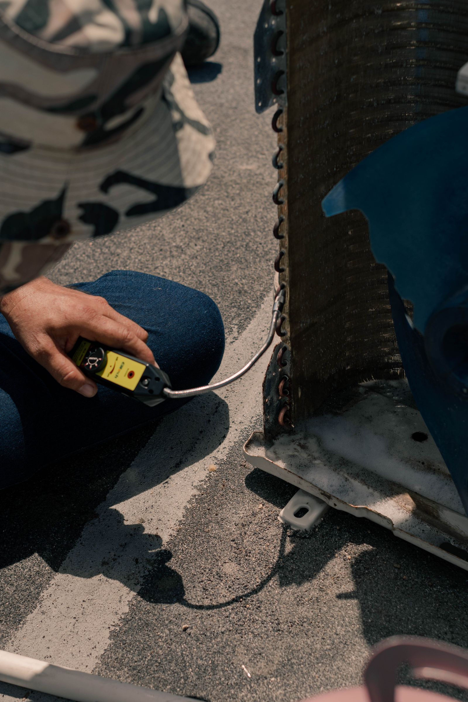 Technician working on an air-conditioning unit